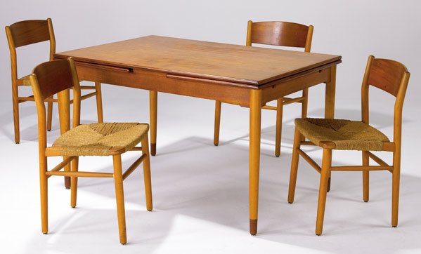 HANS WEGNER Teak dining table with four chairs: HANS WEGNER Teak dining table with four grass-seat chairs. Table marked Made in Denmark. (Provenance available.) Table closed: 29" x 33" x 49"; open: 89"; chairs: 30" x 19" x 15 1/2"