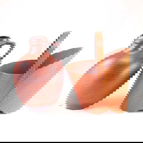 Raymor jug covered in speckled brown and black mat: Raymor jug covered in speckled brown and black matte glaze, together with a large teak handled bucket. Vase marked. Bucket: 21"