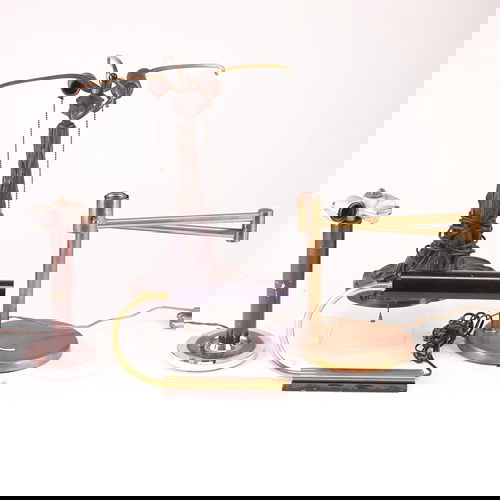 Gilbert Rohde brass and black metal desk lamp (wit: Gilbert Rohde brass and black metal desk lamp (with original drum-shaped glass shade, not pictured), along with three other modern lamps: Nessen brass swing-arm, one brass and chrome table lamp with s