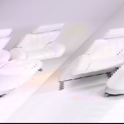 Saporiti pair of white leather recliners with alum: Saporiti pair of white leather recliners with aluminum feet, and matching ottoman (not pictured), together with round white leather ottoman. Unmarked. Chair: 36" x 34" x 36"