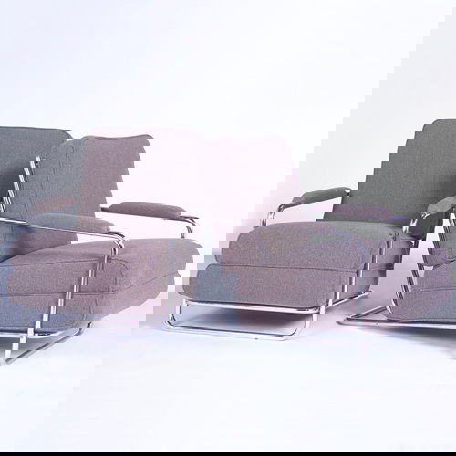 GILBERT ROHDE/TROY SUNSHADE Pair of lounge chairs: GILBERT ROHDE/TROY SUNSHADE Pair of lounge chairs with tubular polished chrome frame, and slatted metal seat supports, its cushions and armrests re-upholstered in taupe-colored Knoll fabric. Unmarked.