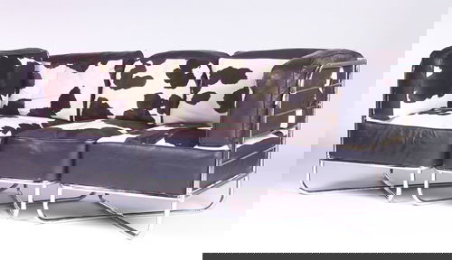 WOLFGANG HOFFMANN/HOWELL Three-piece sectional dav: WOLFGANG HOFFMANN/HOWELL Three-piece sectional davenport, c. 1936, with tubular chrome frame and loose cushions upholstered in cowhide and black leather. Unmarked. 31" x 79 1/2" x 28 1/2"