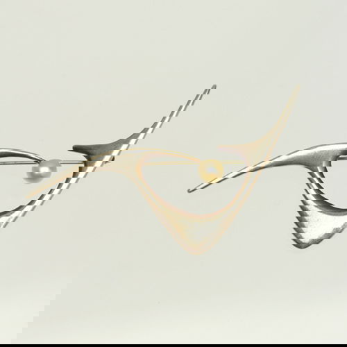 ED WIENER Biomorphic brooch in sterling silver wit: ED WIENER Biomorphic brooch in sterling silver with pearl. Stamped "Ed Wiener". 1" x 3"