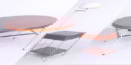 GEORGE NELSON/HERMAN MILLER Two teak pieces: coffe: GEORGE NELSON/HERMAN MILLER Two teak pieces: coffee table with circular walnut top and end table with attached lamp, the lamp with three sockets and original shade, the table with single drawer and lo