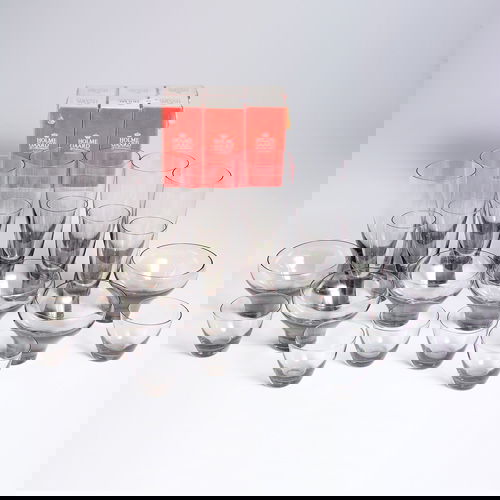 HOLMEGAARD Set of thirty glasses in smokey crystal: HOLMEGAARD Set of thirty glasses in smokey crystal, six each of large and small drinking glasses, dessert glasses in two sizes, and 2 oz. port sherry glasses in original packaging. Some marked. Talles