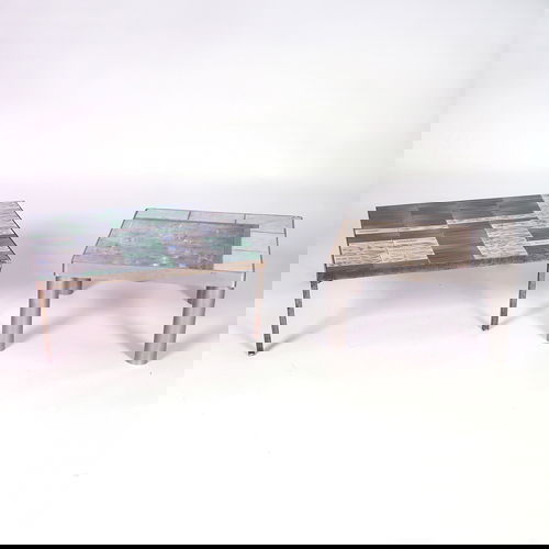 ROGER CAPRON, etc. Two tile-top tables: one by R.: ROGER CAPRON, etc. Two tile-top tables: one by R. Capron with flowers in shades of blue, green and mauve; the other with one large tile surrounded by six smaller ones in white, mottled beige and brown