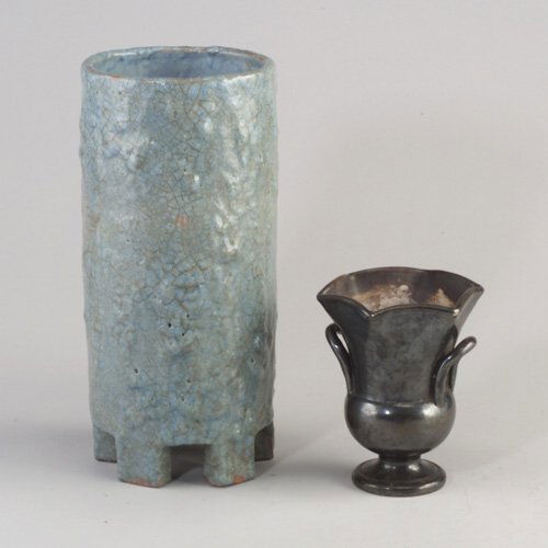 Two Italian vases: large RAYMOR cylindri: Two Italian vases: large RAYMOR cylindrical covered in frothy blue and umber crackled glaze; the other urn-shaped covered in gunmetal glaze. Wear to glaze on urn. Both marked. 13 1/4" and 6 1/2" h