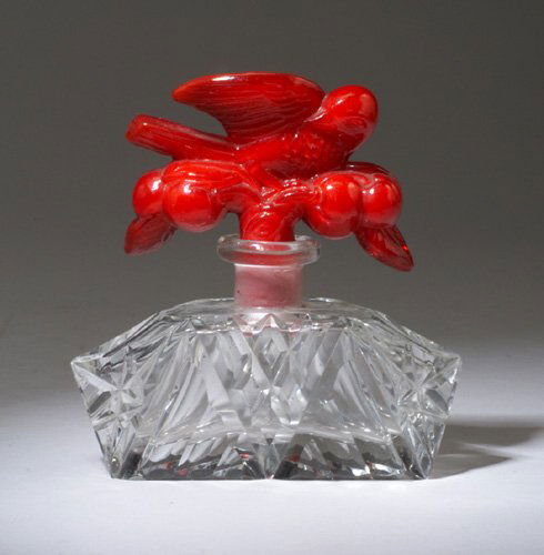 INGRID perfume bottle, circa 1930s, in cl: INGRID perfume bottle, circa 1930s, in clear crystal with an opaque red stopper. Ht. 4 1/2 in (11.3 cm)
