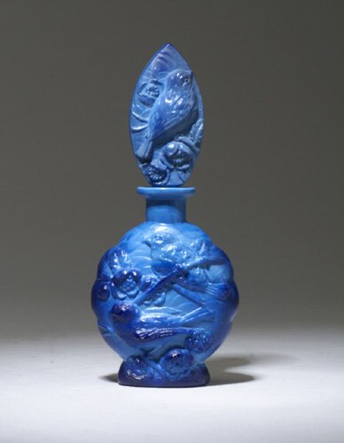 INGRID perfume bottle, circa 1920s, in op: INGRID perfume bottle, circa 1920s, in opaque blue crystal, with dauber. Stenciled INGRID. Ht. 6 in (15 cm)