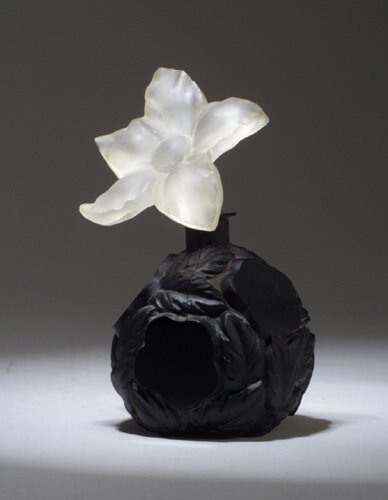 INGRID perfume bottle, circa 1920s, in op: INGRID perfume bottle, circa 1920s, in opaque black crystal, with frosted stopper and dauber. Ht. 5 1/4 in (13 cm)