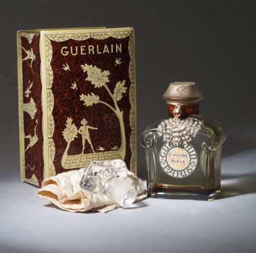 "L'Heure Bleu," a BACCARAT perfume bottl: "L'Heure Bleu," a BACCARAT perfume bottle for Guerlain, circa 1920s, in clear crystal with label, seal and display box. Stenciled BACCARAT. Ht. 4 3/4 in (12 cm)