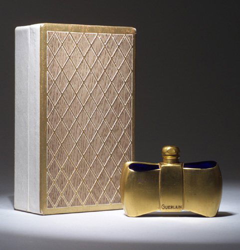 "Dawamesk," a BACCARAT perfume bottle fo: "Dawamesk," a BACCARAT perfume bottle for Guerlain, circa 1930s, in cobalt crystal with gilt finish and enamel name labels, sealed, in display box. Stenciled BACCARAT. Ht. 2 1/4 in (5.6 cm)