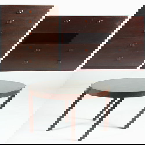 GILBERT ROHDE/HERMAN MILLER Three pieces: bookcas: GILBERT ROHDE/HERMAN MILLER Three pieces: bookcase/desk with cabinet and drop-front door over two long drawers; matching five-drawer dresser; and occasional table with circular top. Marked with labels