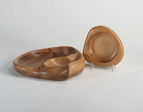 RUSSEL WRIGHT Two rare wood serving piec: RUSSEL WRIGHT Two rare wood serving pieces: a sculptural two-compartment bowl from the Oceana line, and a triangular broad-rimmed side dish with circular center. Both branded "Russel Wright" in script