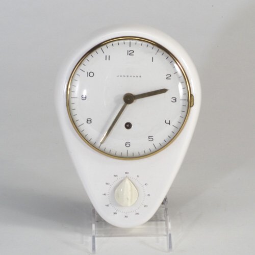 MAX BILL Rare glazed ceramic and enamele: MAX BILL Rare glazed ceramic and enameled metal wall clock, 1950s, inverted ovoid form with brass hands and trim around dial cover, over built-in timer, with key for winding. Clock impressed "RD" Engl