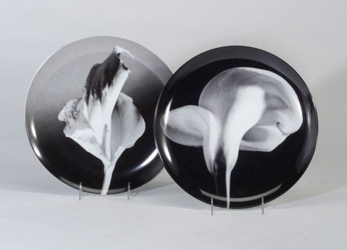 ROBERT MAPPLETHORPE Two SWID POWELL larg: ROBERT MAPPLETHORPE Two SWID POWELL large decorated porcelain plates, "Calla Lily," 1984, and "Flower," 1986, in black and white. Each signed, dated, and titled on reverse, in original boxes. Dia.: 12