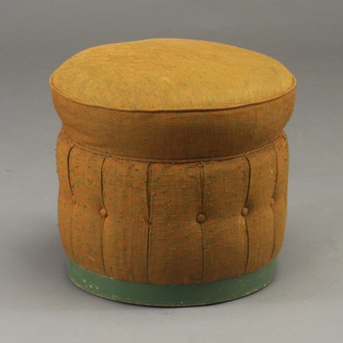 GILBERT ROHDE Rare ottoman with circular: GILBERT ROHDE Rare ottoman with circular top and tufted mid-section upholstered in orange and green fabric, on a green enameled wood base. Unmarked. 16" x 18" dia.