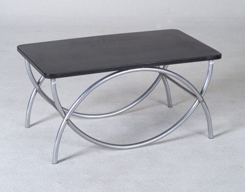 WOLFGANG HOFFMANN HOWELL occasional tabl: WOLFGANG HOFFMANN HOWELL occasional table with rectangular black laminate top on tubular chrome base. Howell decal. 17" x 34" x 20"