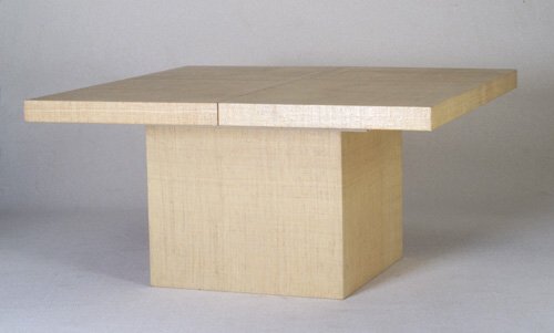 KARL SPRINGER (attrib.) Extension dining: KARL SPRINGER (attrib.) Extension dining table with square top on cubed pedestal base, entirely covered in lacquered grass cloth finish. Includes two 20" leaves. Ernest Masi, NY, retailer's label. Clo