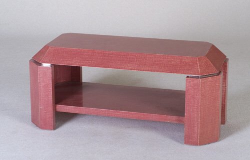 KARL SPRINGER Coffee table with pyramida: KARL SPRINGER Coffee table with pyramidal top on polished steel risers and faceted plank legs, with lower shelf, covered in an ivory and mauve lacquered finish. Unmarked. 18 1/2" x 42" x 19 1/4"