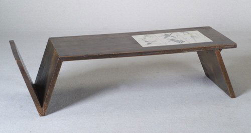 1950s coffee table with mag: 1950s coffee table with magazine rack at one end and six ceramic tiles by JAY, decorated with circus animals and performers in polychrome, embedded in its top. Hairlines to three tiles. Unmarked. 14 1