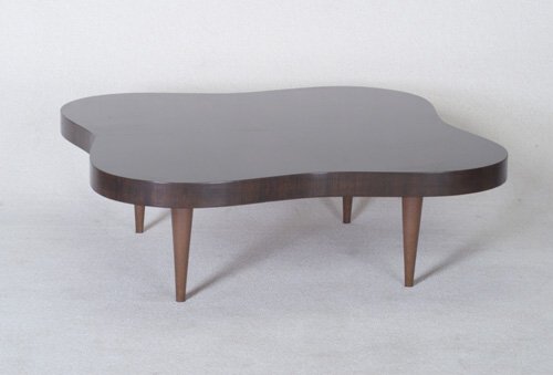 GILBERT ROHDE Fine HERMAN MILLER Paldao: GILBERT ROHDE Fine HERMAN MILLER Paldao coffee table with curvilinear top on four short, tapering legs with tacked-on brown leatherette. Foil label, "Herman Miller/Gilbert Rohde Design," with stencile