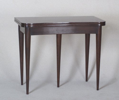 GILBERT ROHDE HERMAN MILLER Paldao conso: GILBERT ROHDE HERMAN MILLER Paldao console/extension table with hinged, serpentine-edged top on tapering legs. Includes three 18" leaves. Stenciled 4166. Closed: 30" x 20" x 36"