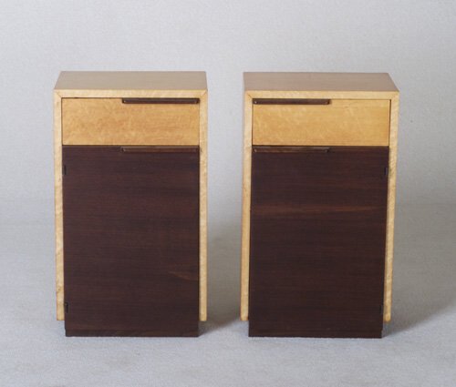 GILBERT ROHDE Pair of HERMAN MILLER waln: GILBERT ROHDE Pair of HERMAN MILLER walnut and bird's eye maple veneer nightstands, en suite with preceding. Foil label, "Herman Miller Furniture Co./Zeeland Michigan/Original Rohde Design," with sten