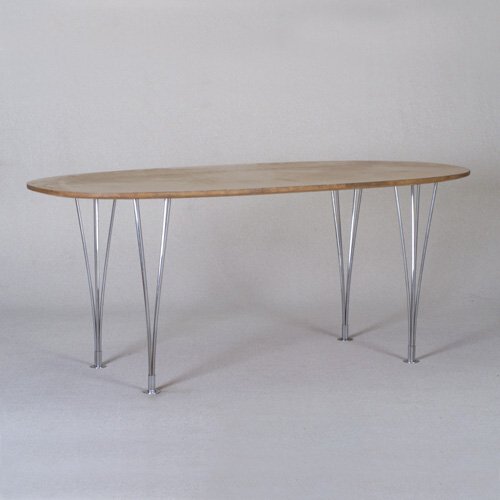 BRUNO MATHSSON: FRITZ HANSEN dining table with oval wood veneer top on four removable polished chrome wire legs. Foil labels. 27 1/2" x 67" x 33 1/2"
