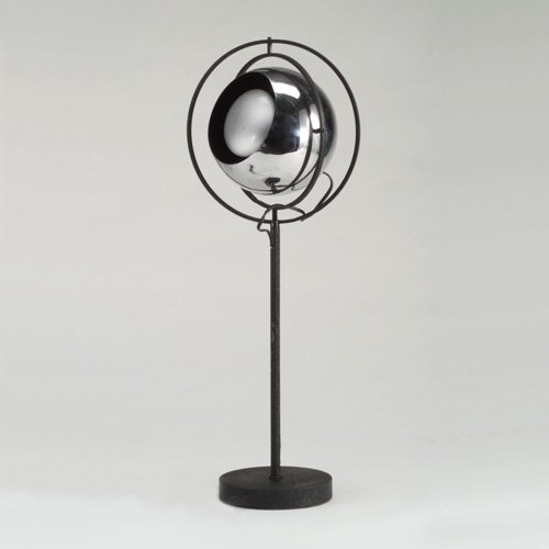 ROBERT SONNEMAN: Table lamp with pivoting bright chrome fixture mounted on black metal base. Unmarked. 25 1/4" x 9 1/4"