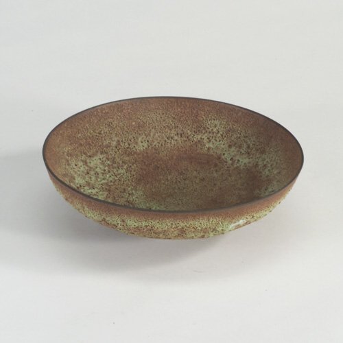JAMES LOVERA: Fine shallow bowl covered in mahogany and chartreuse volcanic glaze. Incised "Lovera." 2 1/2" x 8"