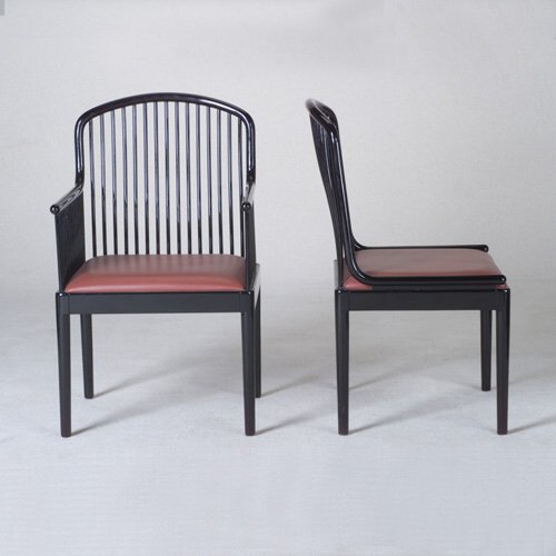 STENDIG: Six ³Andover" spindled dining chairs designed by Davis Allen, two arm- and four side-, each with black lacquered frame and original leather-upholstered seat pad in rose. (Two shown). Stendig paper ta