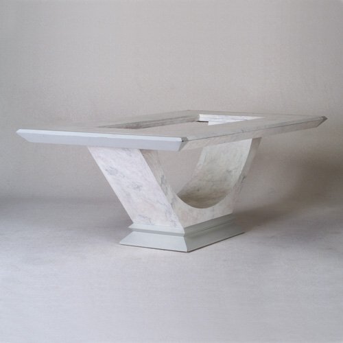 CARSON: Extension dining table with bevel-edged rectangular top and plate glass insert, on semi-circular pedestal shaft and stepped base, in gray and faux-marble laminate finish. Includes two 18" leaves for e