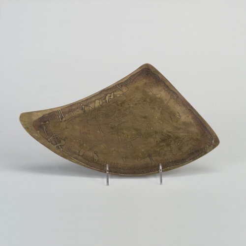 ED WIENER: Free-form brass tray, its interior acid-etched with an abstract design. Stamped "Handwrought by Ed Wiener/'50." 13 3/4" x 8"