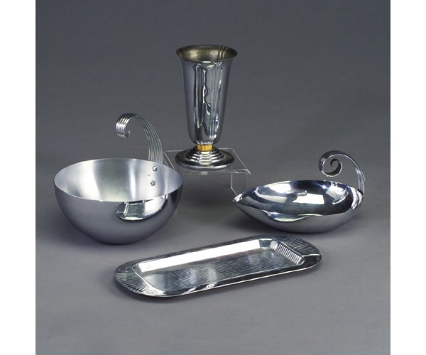 Four assorted CHASE bright chrome pieces: Four assorted CHASE bright chrome pieces: "Minerva" vase with yellow bakelite stem; hemispheric ice bucket with curled handle designed by RUSSEL WRIGHT; "Tulip" serving dish; and rectangular tray. All