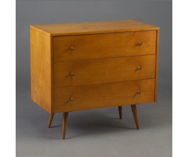 PAUL McCOBB for WINCHENDON "Planner Grou: PAUL McCOBB for WINCHENDON "Planner Group" three-drawer dresser with conical brass pulls on tapering dowel legs. Several scratches to original finish. Paper label. 33" x 36" x 18 1/4"