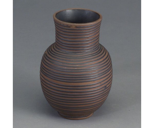 DESIGN TECHNICS bulbous vase with applie: DESIGN TECHNICS bulbous vase with applied squeezebag threaded pattern in black on brown bisque clay. Stamped "Design Technics II". 7 1/2"