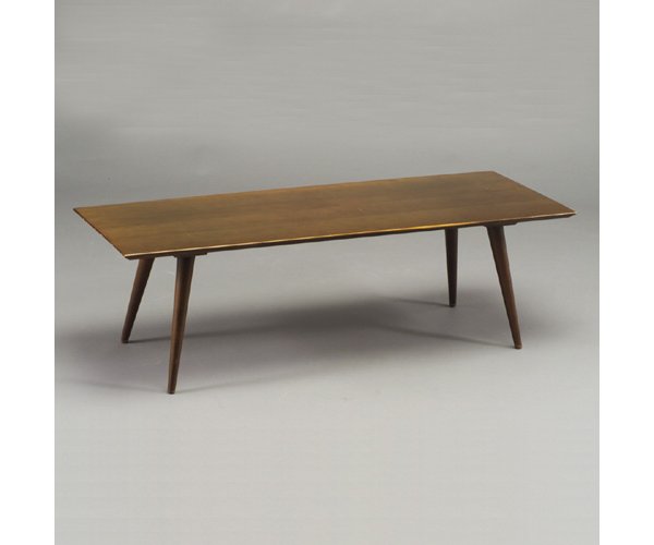 PAUL McCOBB for WINCHENDON "Planner Gro: PAUL McCOBB for WINCHENDON "Planner Group" dark-stained coffee table with rectangular top and flaring dowel legs. Scratches to top. Foil label. 14 3/4" x 48" x 18"