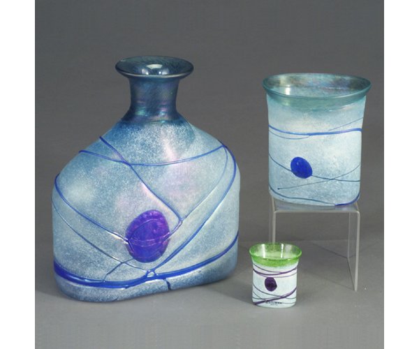 Three BERTIL VALLIEN for KOSTA BODA gla: Three BERTIL VALLIEN for KOSTA BODA glass vessels with free-form threading on a pale ground, the bottle and vase in blue on blue, the cabinet piece in purple on chartreuse. All acid-etched with artist