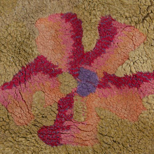 EDWARD FIELDS Shag rug with multicolored flowers: EDWARD FIELDS Shag rug with multicolored flowers on a gold ground. Signed on selvage. 85" x 101"