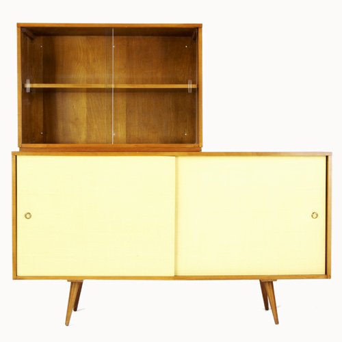 PAUL McCOBB/WINCHENDON Planner Group maple creden: PAUL McCOBB/WINCHENDON Planner Group maple credenza with four interior drawers and single shelf, supporting a small bookcase with two sliding glass doors. Branded script mark to top piece. 58" x 60" x