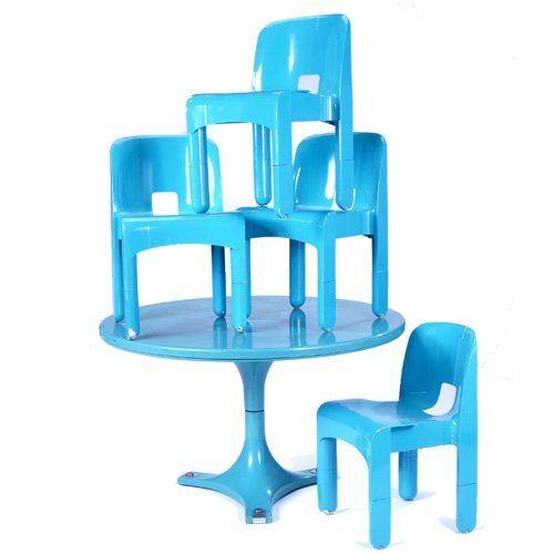 JOE COLOMBO/KARTELL Teal polymer pedestal dining: JOE COLOMBO/KARTELL Teal polymer pedestal dining table and four Universale stacking chairs. Chairs with embossed mark. Table: 28" x 48", chairs: 28 1/2" x 17"sq