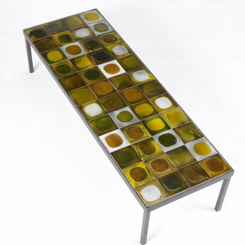 ROGER CAPRON Coffee table with glazed tile top on: ROGER CAPRON Coffee table with glazed tile top on a black iron base. Top signed R. Capron. 11" 47 3/4" x 16"
