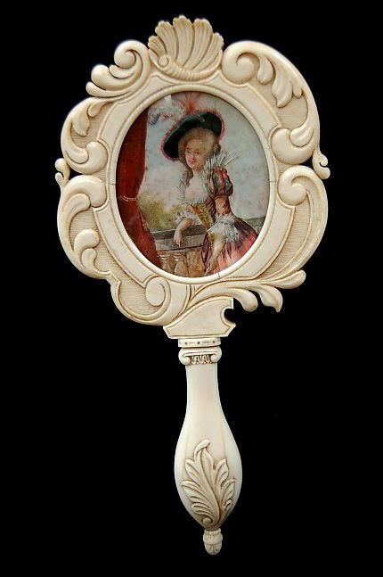 Scarce Victorian solid ivory hand mirror: Scarce Victorian solid ivory hand mirror with hand-painted miniature painting of a French lady on ivory