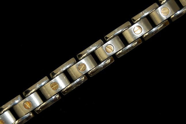 Men's 18K and titanium 14 link 8.75" bracelet: Men's 18K and titanium 14 link 8.75" bracelet with 18K gold screws, hallmarked titanium and 18K, retails at $899.99