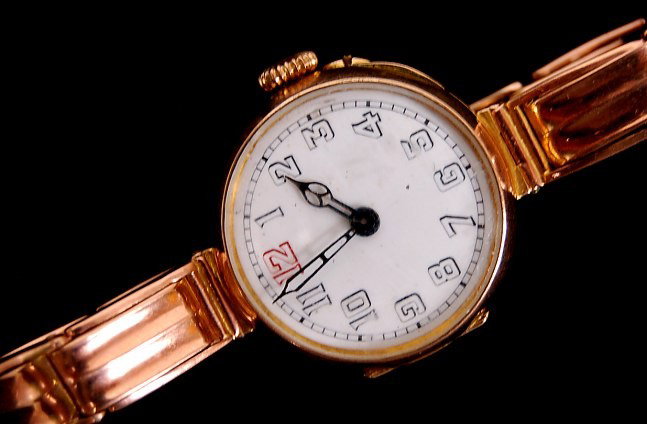 Antique lady's English 9K rose gold watch: Antique lady's English 9K rose gold watch with stretch-flex gold band, porcelain dial, hand made Swiss movement, triple hallmarked 27mm case, movement and band, weighing approx. 7 grams, c.1890-1910, 