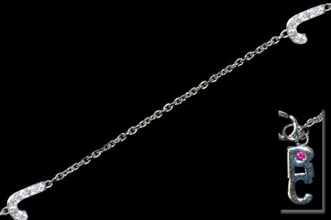 Roberto Coin 18K diamond 16" initial "J" necklace: Roberto Coin 18K diamond 16" initial "J" necklace having 5 spaced "J" initials pavé set with 80 round diamonds on both sides, weighing 5.6 grams, retail replacement value $2,900.00