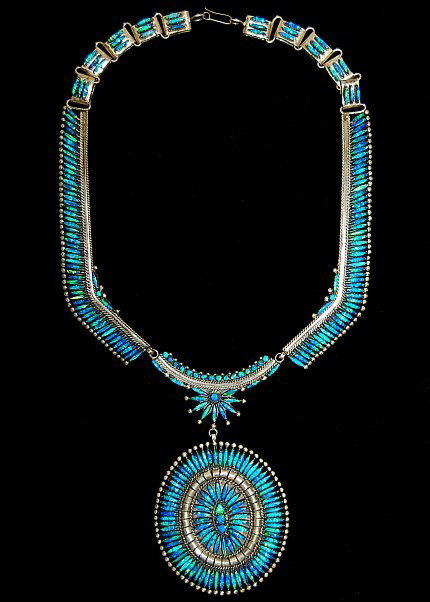 Zuni sterling needlepoint opal 19" necklace: Zuni sterling needlepoint lab opal 19" necklace with 4" drop (the medallion measuring 3" x 2.5") set with 266 marquis cut lab opals weighing 107.6 grams, artist signed