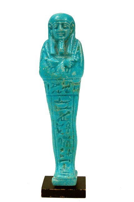 Egyptian faience mummiform ushabti: Egyptian blue faience mummiform ushabti with lappet wig, crossed arms holding pick and hoe, intact with good detail, hieroglyphics on front, mounted on metal museum mount c.664-300 B.C. Provenance: ex