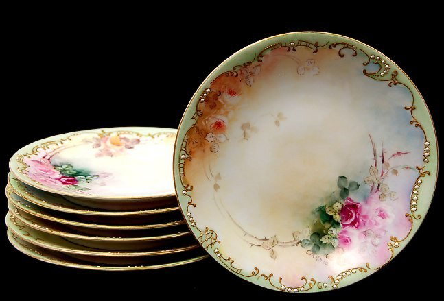 7 Limoges T&V Pollock hand painted 7.25" plates: Lot of 7 Limoges T&V Pollock hand painted 7.25" plates having pastel floral colours accented with applied enamel and 22K, artist signed E. M. Kale c.1909, excellent condition, no chips or cracks,